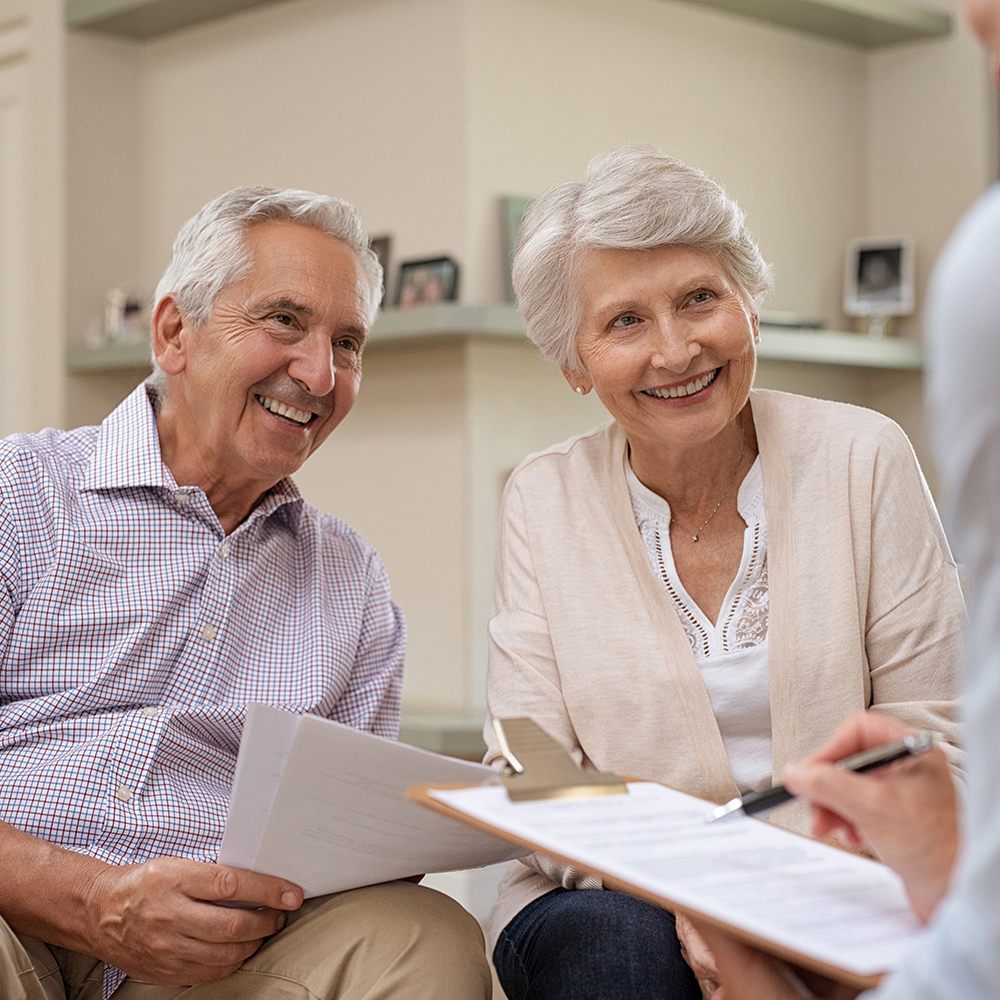 elderly couple going over life insurance plans