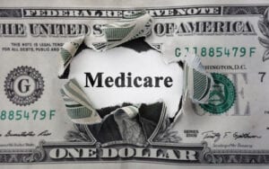 Medicare,News,Headline,,Inside,Of,Torn,Dollar,Bill